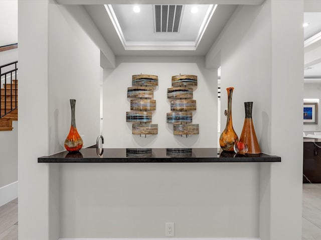 bar featuring a tray ceiling