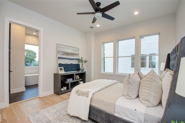 bedroom featuring ceiling fan and light hardwood / wood-style flooring