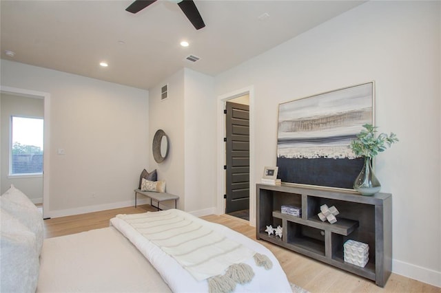 bedroom featuring light hardwood / wood-style flooring and ceiling fan