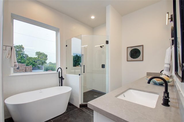 bathroom with vanity, plus walk in shower, and tile patterned flooring