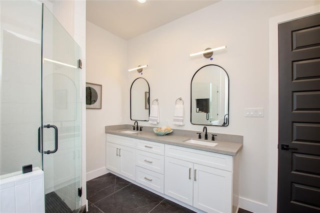 bathroom featuring vanity and a shower with shower door