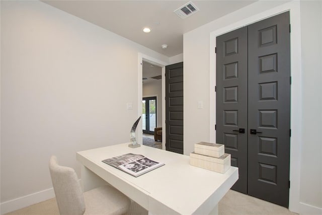 office area with light colored carpet