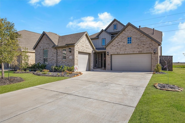 view of front of property with a garage and a front yard