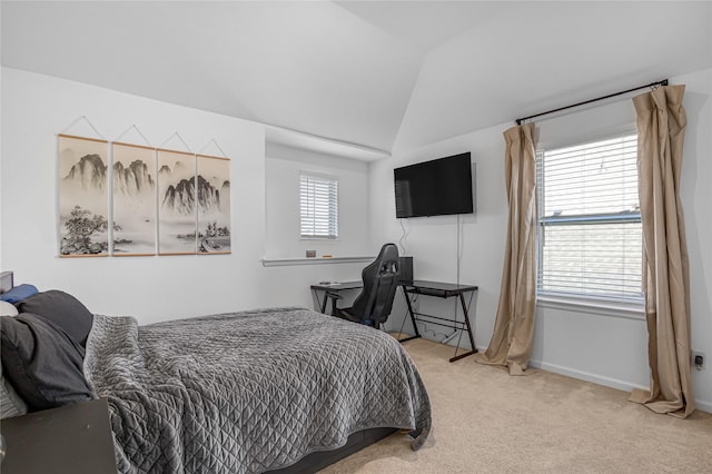 carpeted bedroom featuring vaulted ceiling