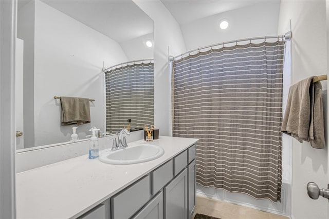 bathroom with shower / bath combination with curtain and vanity