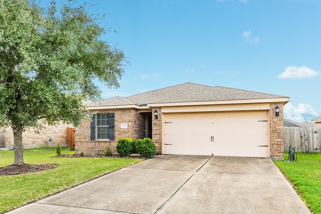 ranch-style house featuring a garage and a front lawn