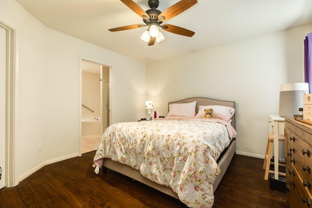 bedroom with ensuite bath, dark wood-type flooring, and ceiling fan