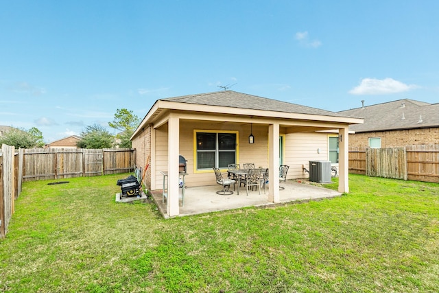 back of property featuring a lawn, central AC unit, and a patio area