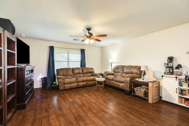 living room with dark hardwood / wood-style floors and ceiling fan