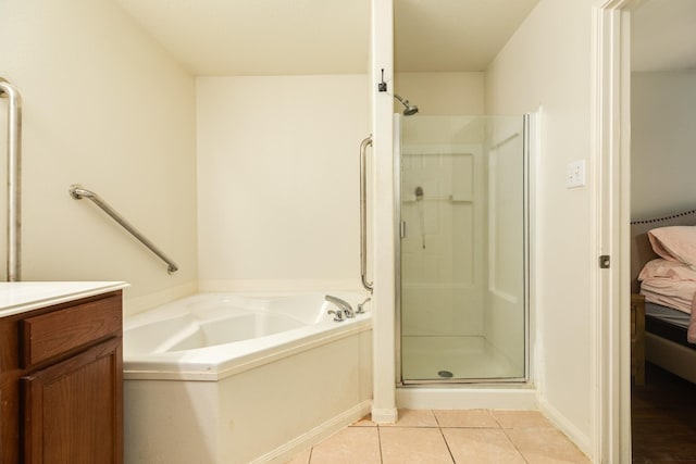 bathroom with vanity, tile patterned floors, and shower with separate bathtub