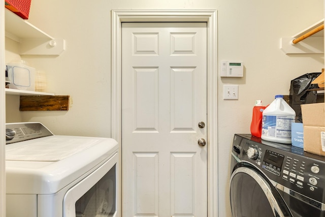 laundry room featuring separate washer and dryer