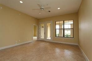 spare room with ceiling fan