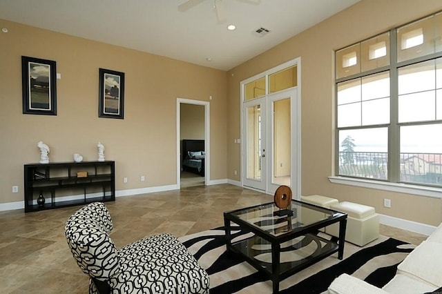 living room with french doors and ceiling fan