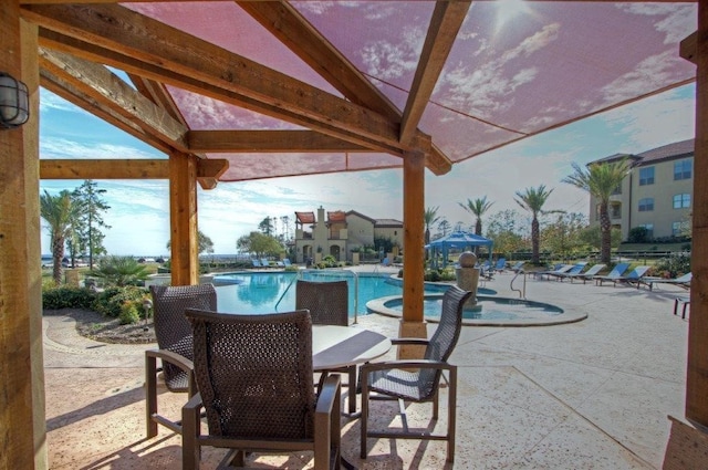 view of patio / terrace featuring a community pool