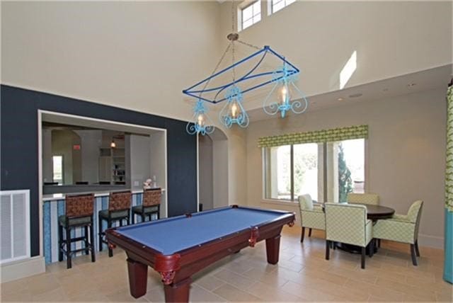 rec room featuring billiards and a high ceiling