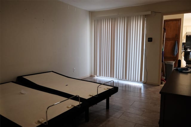 bedroom featuring tile patterned flooring