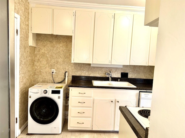 laundry room featuring washer / clothes dryer and sink