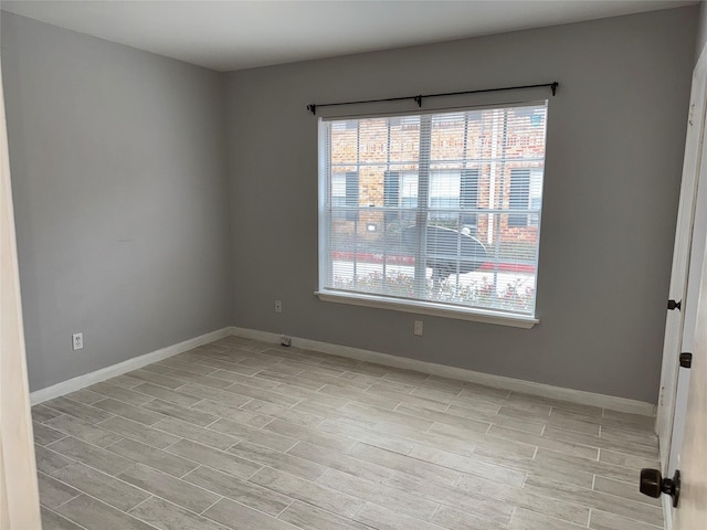 spare room featuring light hardwood / wood-style floors