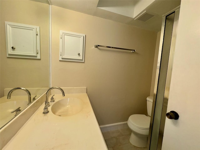 bathroom with tile patterned floors, toilet, and vanity