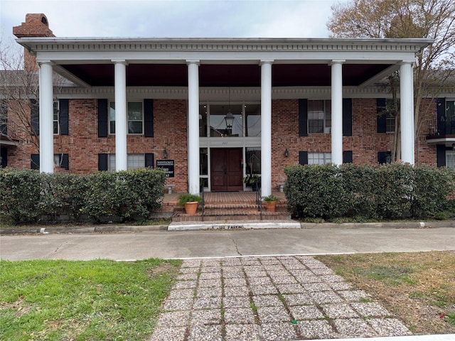 property entrance featuring covered porch