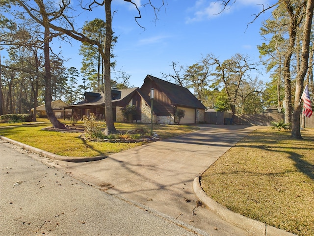 view of front facade featuring a garage and a front lawn