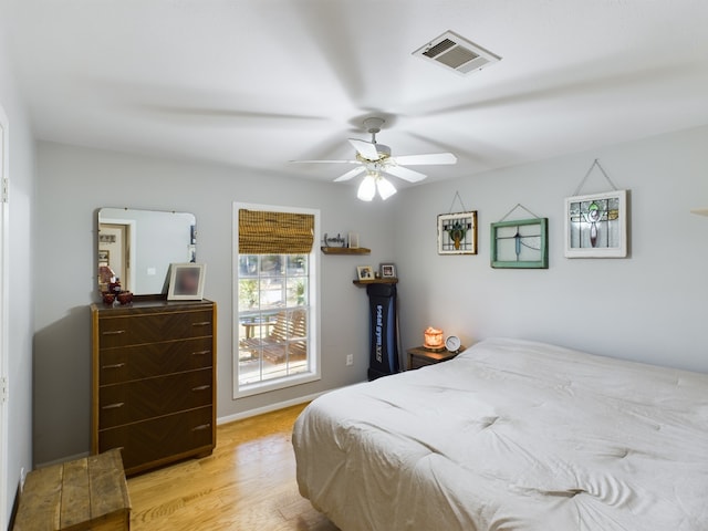 bedroom with ceiling fan and light wood-type flooring