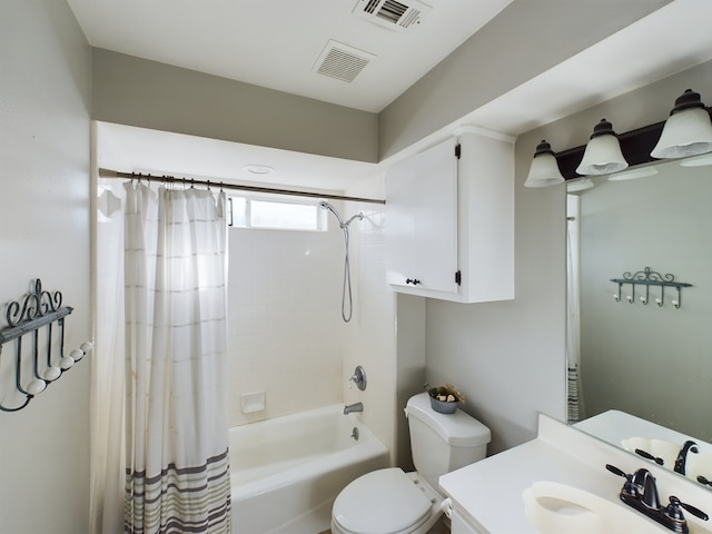 full bathroom with shower / tub combo with curtain, vanity, and toilet