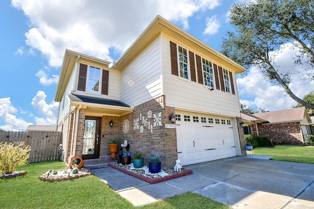 view of front of property featuring a garage and a front yard