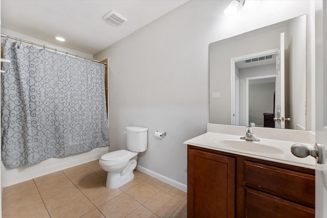 bathroom featuring toilet, shower / tub combo, vanity, visible vents, and tile patterned floors