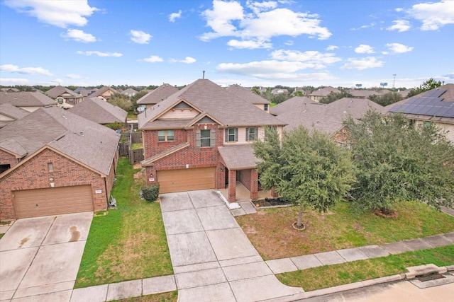 view of front of house with a residential view, concrete driveway, brick siding, and a front lawn