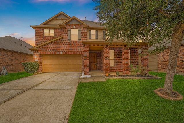 view of front of property featuring a garage, driveway, brick siding, and a front lawn