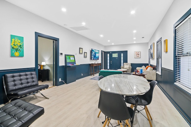 dining area featuring light wood-type flooring