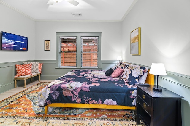 bedroom with crown molding and ceiling fan