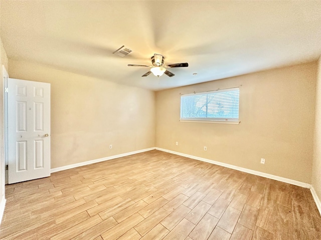 spare room featuring ceiling fan and light hardwood / wood-style floors