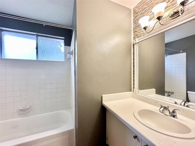 bathroom with vanity and tiled shower / bath combo