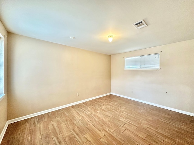 empty room with light wood-type flooring