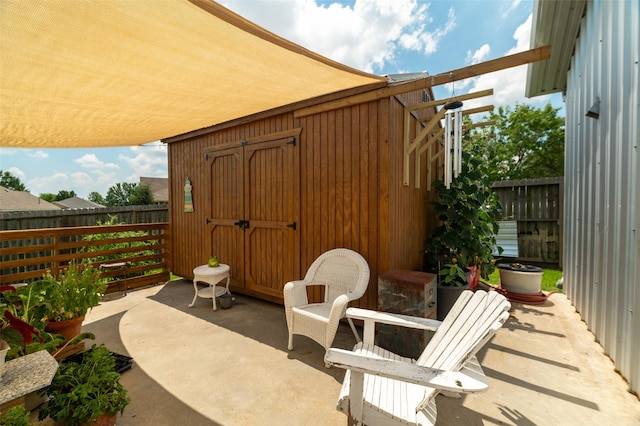 view of patio / terrace featuring a shed