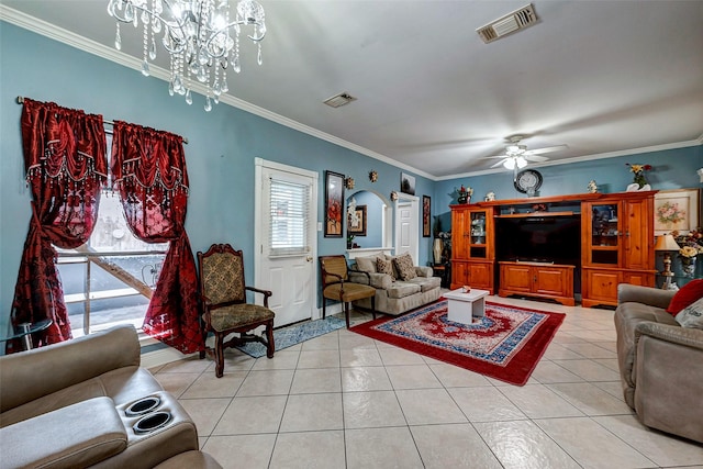 living area featuring ornamental molding, arched walkways, visible vents, and light tile patterned flooring