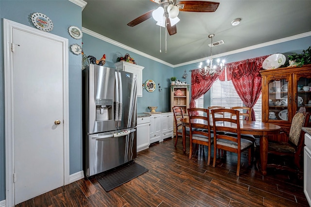 dining area featuring ornamental molding, dark wood-type flooring, and visible vents