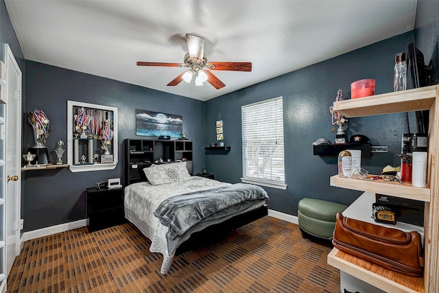 bedroom featuring a ceiling fan and baseboards