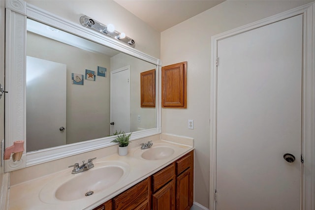 full bath featuring double vanity and a sink