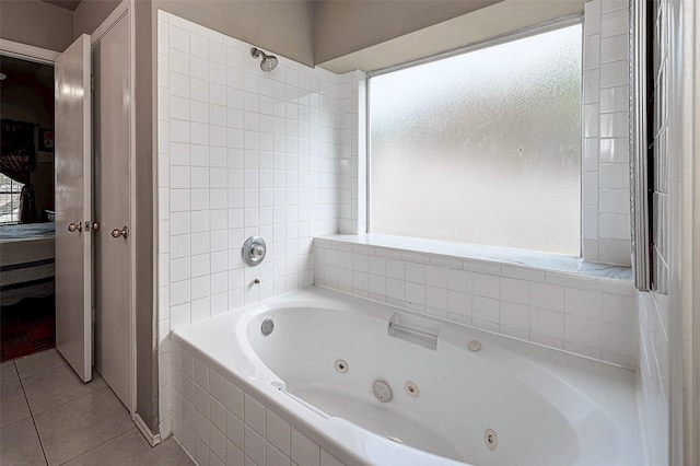 bathroom with a whirlpool tub and tile patterned floors