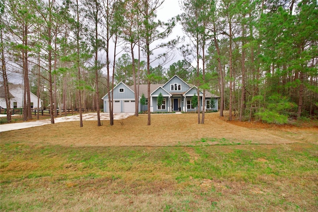 single story home featuring a garage and a front lawn