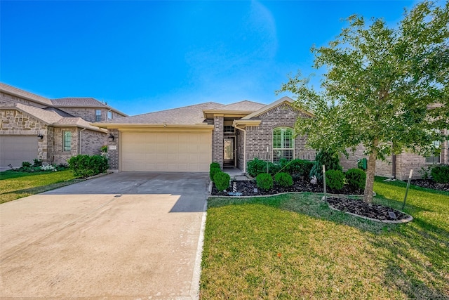 view of front of property with a garage and a front lawn