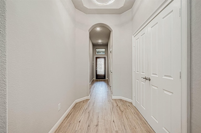 corridor with light wood-type flooring