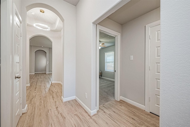 hallway with light hardwood / wood-style flooring