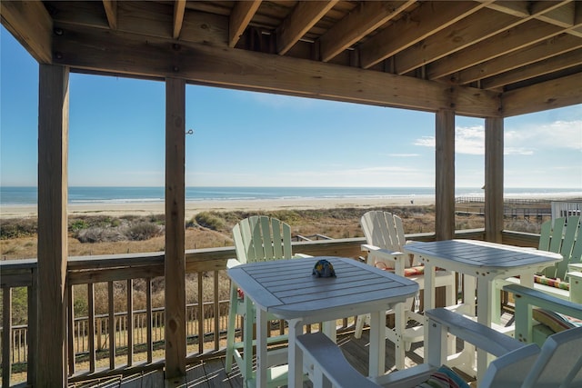 exterior space featuring a water view and a view of the beach