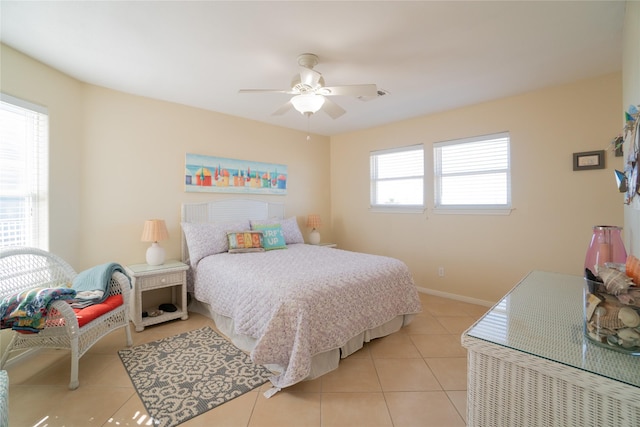 tiled bedroom with ceiling fan