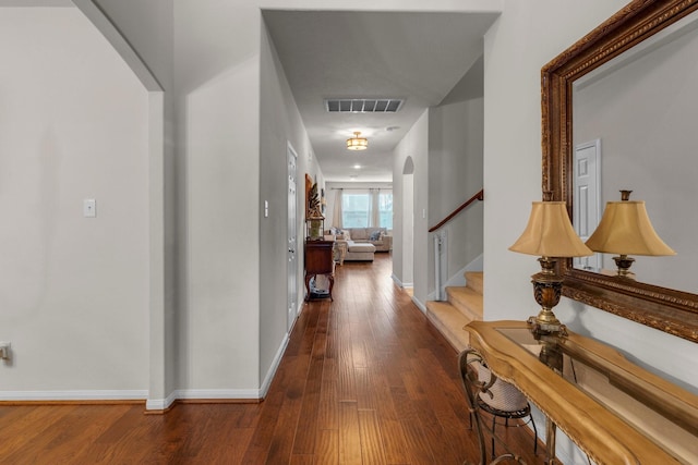 corridor with hardwood / wood-style floors