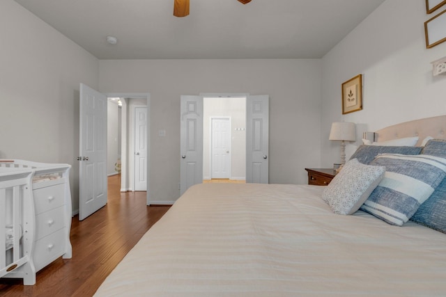 bedroom featuring wood-type flooring and ceiling fan